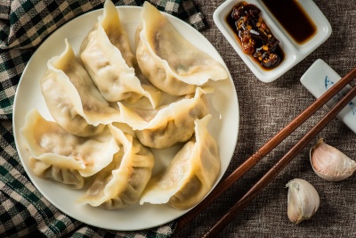 What is the traditional dish eaten to celebrate the Chinese New Year?