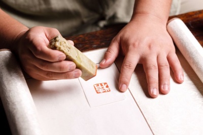 What do Chinese traditionally use to put their name on a official documents?